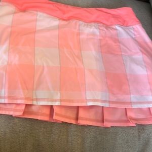 Pinky peach tennis skirt